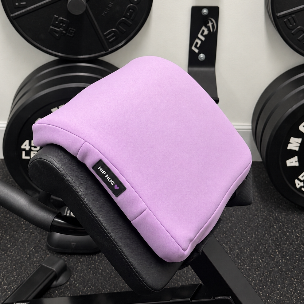 Lavender HIPHUG foam pad draped over a gym bench pad with the HIPHUG label visible